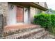 Inviting entrance featuring a brick-paved landing and brick steps, providing a warm welcome at 620 Shannon Green Sw Cir, Mableton, GA 30126