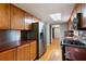 Functional kitchen featuring stainless steel appliances and wood cabinetry, offering modern convenience at 620 Shannon Green Sw Cir, Mableton, GA 30126