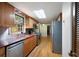 Well-equipped kitchen with stainless steel appliances, wood cabinets, and functional design at 620 Shannon Green Sw Cir, Mableton, GA 30126