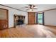 Bright living room boasts a stone fireplace, hardwood floors, and natural light at 620 Shannon Green Sw Cir, Mableton, GA 30126
