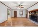 Open living room featuring hardwood floors and a stone fireplace at 620 Shannon Green Sw Cir, Mableton, GA 30126