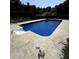 Outdoor swimming pool featuring sparkling blue water and concrete surround at 620 Shannon Green Sw Cir, Mableton, GA 30126