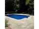 Backyard swimming pool with clean blue water and a surrounding patio area at 620 Shannon Green Sw Cir, Mableton, GA 30126