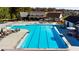 Resort-style pool with lounge chairs, umbrellas, and clubhouse, perfect for relaxation and recreation at 72 Warrior Ct, Braselton, GA 30548
