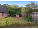 View of the backyard with a partial fence and separate storage shed at 10 Hawk Nw Rd, Cartersville, GA 30121