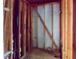 View of the unfinished basement with exposed wood framing and concrete block at 10 Hawk Nw Rd, Cartersville, GA 30121