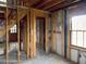 Unfinished basement showing exposed wood framing, concrete walls, and potential for customization at 10 Hawk Nw Rd, Cartersville, GA 30121