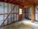 Unfinished basement showcasing wood framing and a door to the outside at 10 Hawk Nw Rd, Cartersville, GA 30121