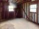Unfinished basement featuring exposed wood framing, concrete block and two windows at 10 Hawk Nw Rd, Cartersville, GA 30121