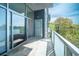 Relax on this balcony with glass railings and tranquil views, perfect for enjoying the outdoors at 130 Arizona Ne Ave # 309, Atlanta, GA 30307