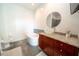 Modern bathroom featuring a vessel sink, granite countertop, sleek vanity, and soaking tub at 130 Arizona Ne Ave # 309, Atlanta, GA 30307