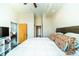 Spacious bedroom with access to living area, plush bedding, and modern ceiling fan at 130 Arizona Ne Ave # 309, Atlanta, GA 30307
