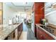 Spacious open-concept kitchen with stainless steel appliances, granite counters, and view of the living room at 130 Arizona Ne Ave # 309, Atlanta, GA 30307
