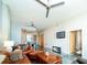Spacious living area with sleek flooring, modern furniture, and an open layout to the kitchen at 130 Arizona Ne Ave # 309, Atlanta, GA 30307