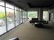 Modern lounge with floor-to-ceiling windows, offering scenic views and stylish seating arrangements at 130 Arizona Ne Ave # 309, Atlanta, GA 30307