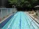 Inviting lap pool featuring cascading water features, clear safety glass, and a serene outdoor area at 130 Arizona Ne Ave # 309, Atlanta, GA 30307