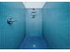 Step into this stylish shower, adorned with vibrant blue tile, offering a refreshing experience at 130 Arizona Ne Ave # 309, Atlanta, GA 30307