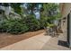 A quaint backyard patio with outdoor seating, perfect for enjoying the serene and private surroundings at 130 Floss Flower Ct, Roswell, GA 30076