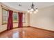 Elegant dining room with hardwood floors and a chandelier at 130 Floss Flower Ct, Roswell, GA 30076