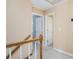 Upstairs hallway showcasing neutral walls, white doors, and carpeted floors at 130 Floss Flower Ct, Roswell, GA 30076