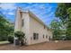 The rear exterior shows the home's architectural details, large windows, and a well-maintained backyard at 130 Floss Flower Ct, Roswell, GA 30076