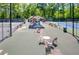 Community tennis courts with a covered seating area, ideal for socializing and watching matches at 130 Floss Flower Ct, Roswell, GA 30076