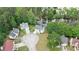 Aerial view of a neighborhood of homes showcasing lovely landscaping and nearby creek at 1914 Phillips Lake Blf, Lithonia, GA 30058