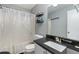 Bathroom with granite counter tops, white cabinets, and shower at 1914 Phillips Lake Blf, Lithonia, GA 30058