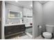 Stylish bathroom features a sleek vanity with a modern, lighted mirror and glass enclosed shower at 1914 Phillips Lake Blf, Lithonia, GA 30058