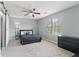 Stylish bedroom with a ceiling fan and a large window at 1914 Phillips Lake Blf, Lithonia, GA 30058