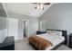 Well-lit bedroom featuring a bed, dresser, and large window at 1914 Phillips Lake Blf, Lithonia, GA 30058