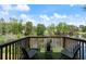Outdoor deck overlooking a serene pond provides a great spot for relaxation at 1914 Phillips Lake Blf, Lithonia, GA 30058
