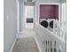 Hallway view showcasing laundry room with modern front load washer and dryer at 1914 Phillips Lake Blf, Lithonia, GA 30058