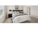 Bedroom featuring a queen bed with decoratively pillows, side tables and lamps with ample natural light at 219 Whispering Pines Ave, Conyers, GA 30094
