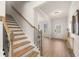 Inviting entryway features hardwood floors, a staircase, and a view into the adjacent living spaces at 219 Whispering Pines Ave, Conyers, GA 30094
