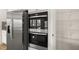 Modern kitchen boasts stainless steel appliances, granite countertops and a spacious walk-in pantry at 219 Whispering Pines Ave, Conyers, GA 30094