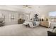 Spacious main bedroom featuring neutral colors, carpet, and a ceiling fan at 219 Whispering Pines Ave, Conyers, GA 30094