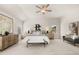 Bright and airy main bedroom with plush carpet, large windows, and stylish furnishings at 219 Whispering Pines Ave, Conyers, GA 30094