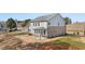 Two-story home featuring a patio and combination siding and brick exterior at 219 Whispering Pines Ave, Conyers, GA 30094