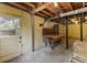Unfinished basement with concrete floor, a door to the exterior, utility hookups and storage at 2558 Landeau Cir, Tucker, GA 30084