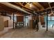 Unfinished basement with concrete floor, work bench and utility hookups at 2558 Landeau Cir, Tucker, GA 30084