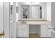 Bathroom featuring a long vanity with storage and a peek into other rooms at 2558 Landeau Cir, Tucker, GA 30084