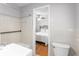 Bathroom with shower-tub and a view into an adjacent bedroom at 2558 Landeau Cir, Tucker, GA 30084