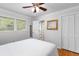 Bedroom with hardwood floors, a closet, and an attached bathroom at 2558 Landeau Cir, Tucker, GA 30084