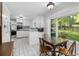 Kitchen with white cabinets, eat-in-area, and plenty of natural light at 2558 Landeau Cir, Tucker, GA 30084