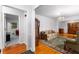 Living room featuring gleaming hardwood floors, a floral sofa, and an antique hutch at 2558 Landeau Cir, Tucker, GA 30084