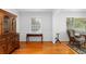 Bright living room with hardwood floors, traditional wood accents, and natural light from large windows at 2558 Landeau Cir, Tucker, GA 30084