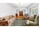 Formal living room with hardwood floors, large windows, and comfortable seating at 2558 Landeau Cir, Tucker, GA 30084