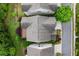 Aerial view of a well-maintained home with a deck surrounded by lush greenery at 7340 Jamestown Dr, Alpharetta, GA 30005