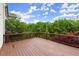 Large wooden deck overlooking a private, wooded backyard at 7340 Jamestown Dr, Alpharetta, GA 30005